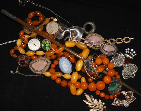 A quantity of mixed costume jewellery including simulated amber beads and an Eterna wrist watch.